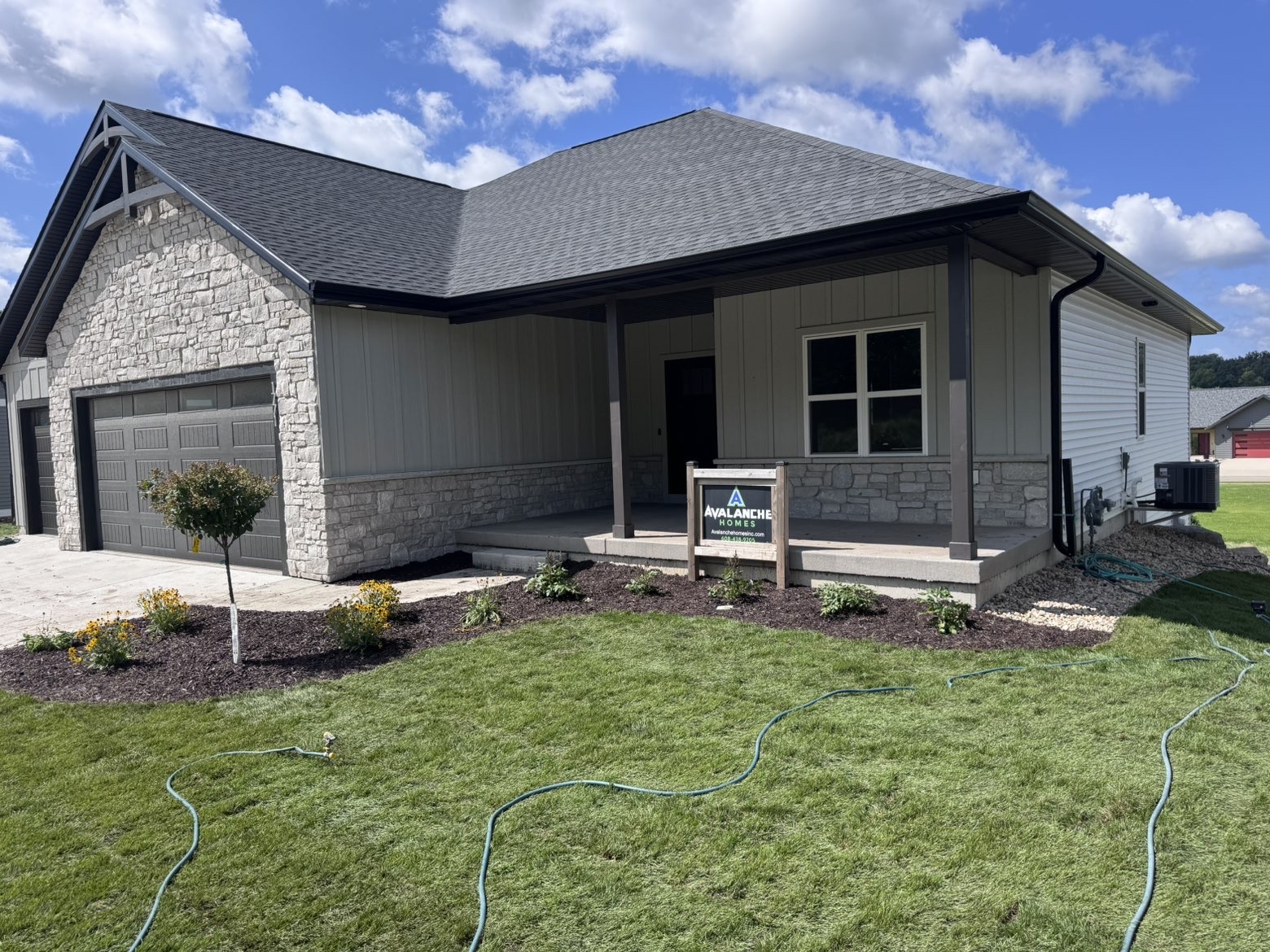 Fresh mulch beds and plantings at a home entrance